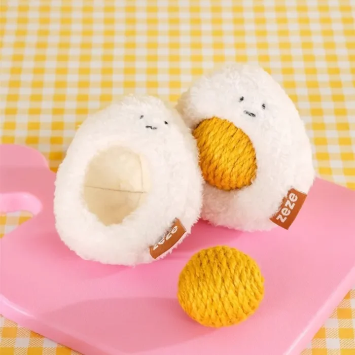 Sunny-Side Up Purr-bo cat toy with a rattling yolk and catnip in both separable parts.