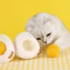 Sunny-Side Up Purr-bo cat toy with a rattling yolk and catnip in both separable parts.