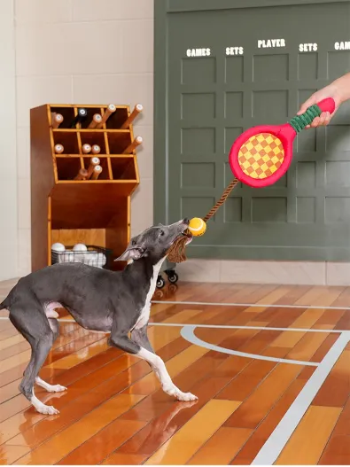 Play fetch and tug-of-war with the "Paw-ltimate Smasher" tennis racket toy. Its reinforced rope and durable chew ball make every interaction fun and perfect for bonding.