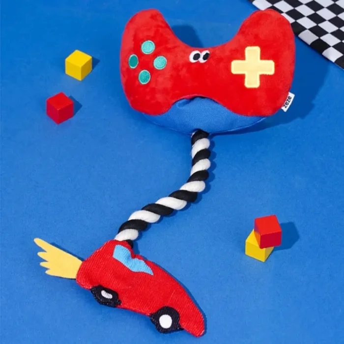 Interactive "Paw Controller" dog toy with chewable tug ropes and squeaky buttons for fetch and tug-of-war games.