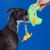 Interactive "Paw Controller" dog toy with chewable tug ropes and squeaky buttons for fetch and tug-of-war games.