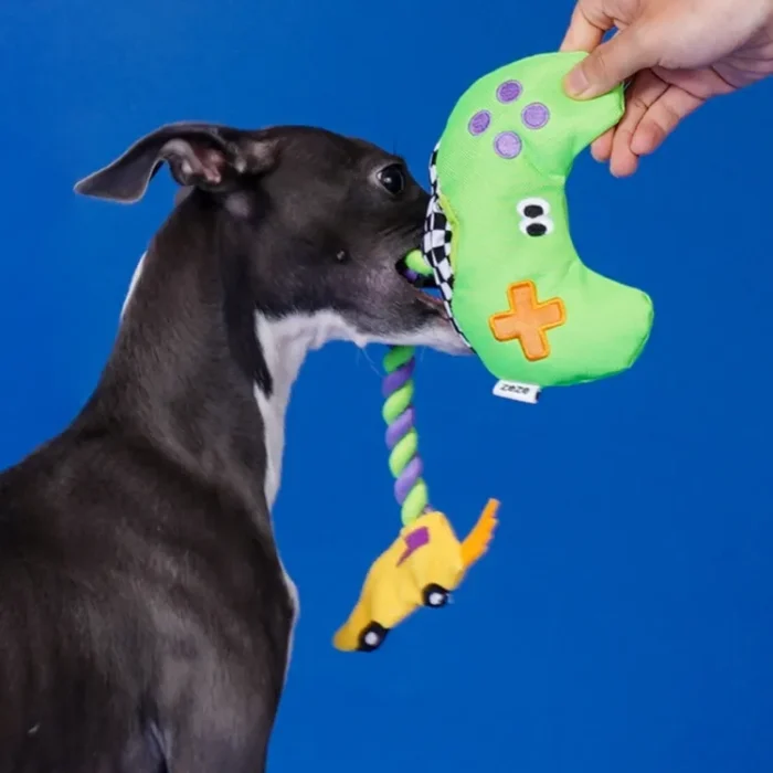 Interactive "Paw Controller" dog toy with chewable tug ropes and squeaky buttons for fetch and tug-of-war games.