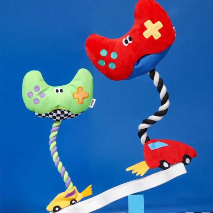 Interactive "Paw Controller" dog toy with chewable tug ropes and squeaky buttons for fetch and tug-of-war games.